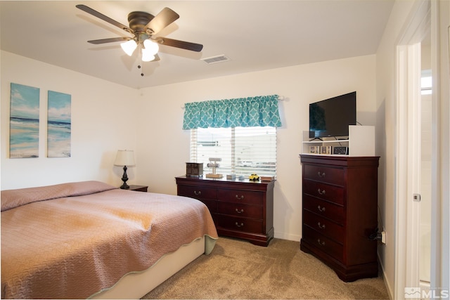 bedroom with visible vents, ceiling fan, light carpet, and baseboards