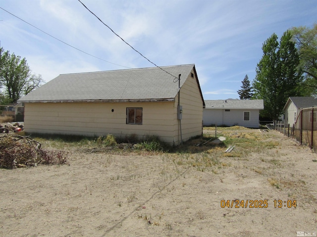 view of home's exterior featuring fence