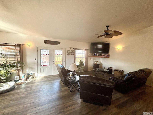 living area featuring wood finished floors and a ceiling fan