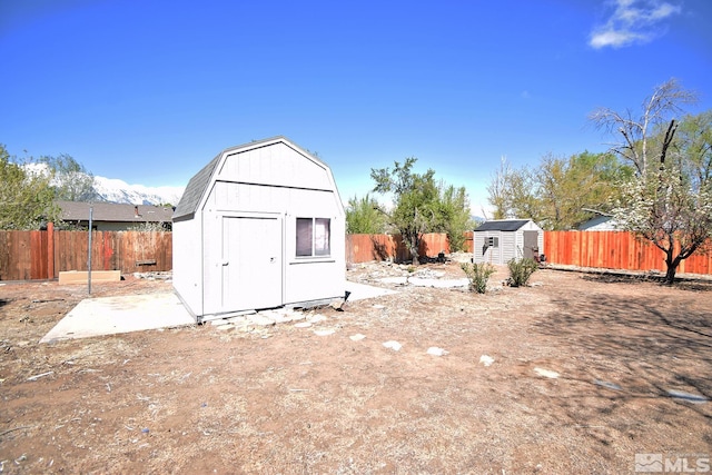 view of shed with a fenced backyard