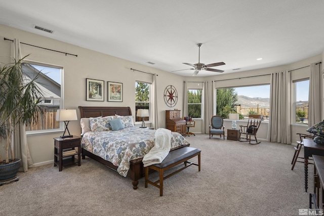 bedroom with visible vents, a ceiling fan, recessed lighting, and light carpet