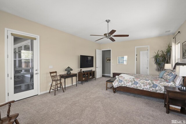carpeted bedroom featuring baseboards, visible vents, and ceiling fan