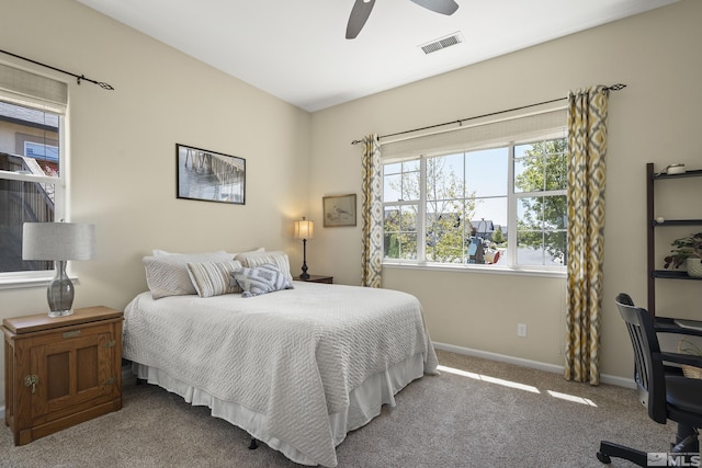 bedroom with visible vents, carpet flooring, baseboards, and ceiling fan