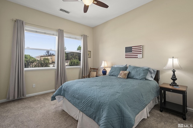 bedroom with visible vents, carpet flooring, baseboards, and ceiling fan