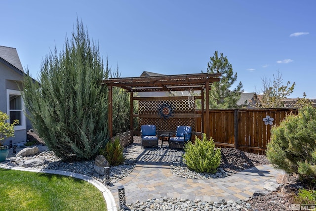 view of patio with a pergola and fence