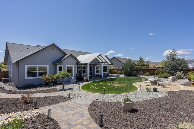 back of house featuring a patio, fence, central AC unit, and roof with shingles