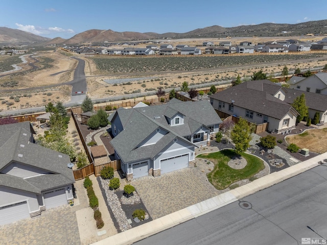 drone / aerial view featuring a mountain view and a residential view
