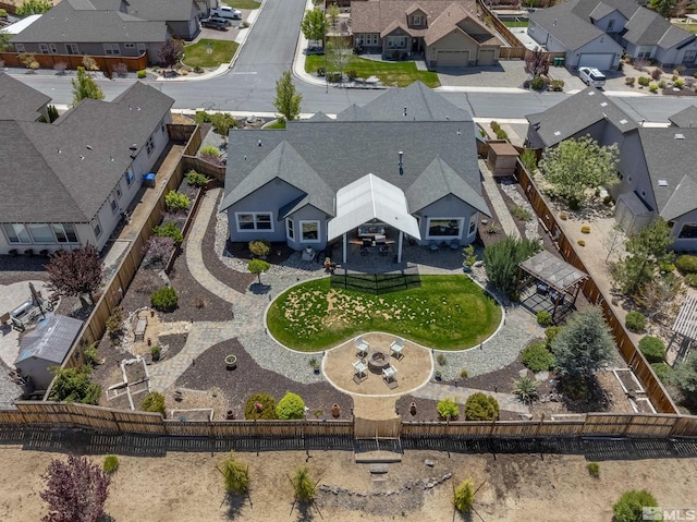 birds eye view of property with a residential view