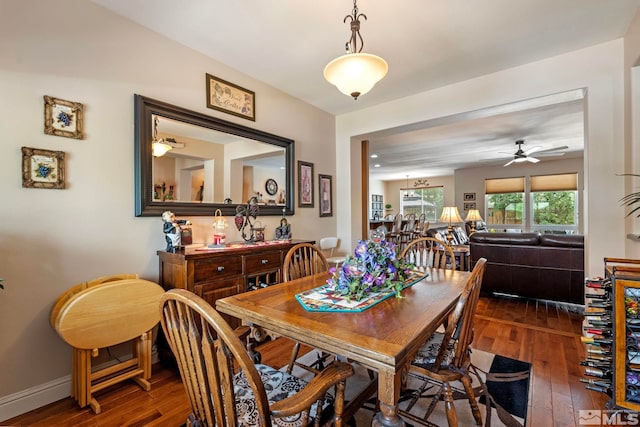 dining space with baseboards, a ceiling fan, and hardwood / wood-style floors