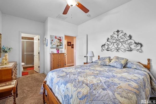 carpeted bedroom featuring visible vents, connected bathroom, and ceiling fan
