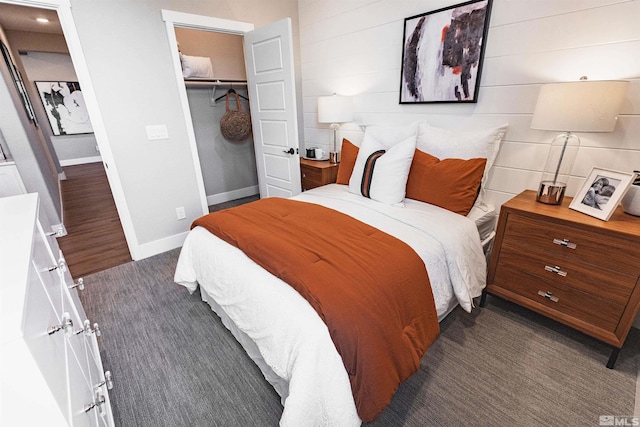 bedroom with baseboards and a closet