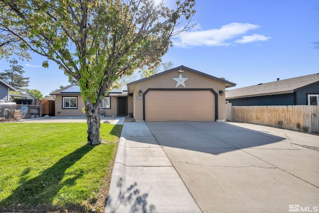 ranch-style house with fence, an attached garage, a front lawn, stucco siding, and concrete driveway