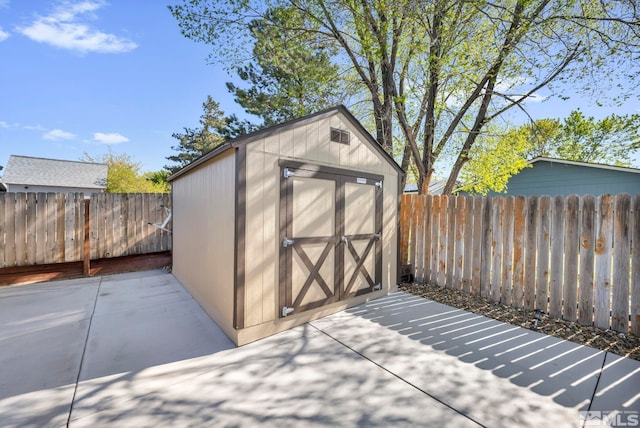 view of shed featuring a fenced backyard