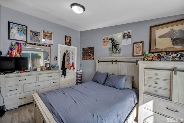 bedroom featuring wood finished floors