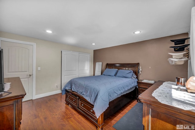 bedroom featuring a closet, recessed lighting, and wood finished floors