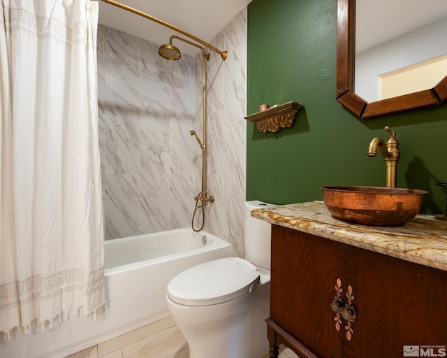 bathroom featuring vanity, toilet, and shower / bathtub combination with curtain