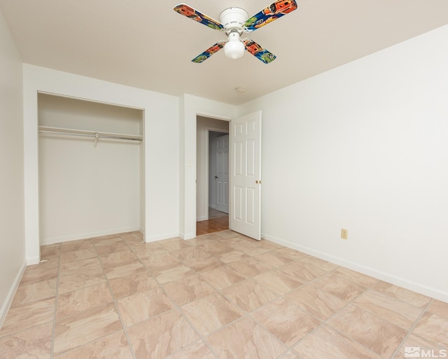 unfurnished bedroom with baseboards and a closet