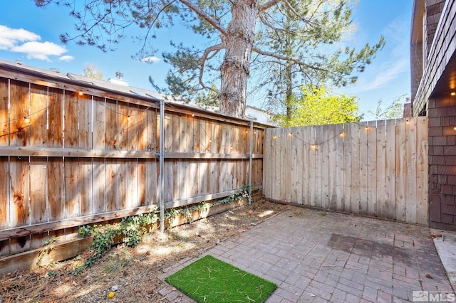 view of yard with a fenced backyard and a patio area