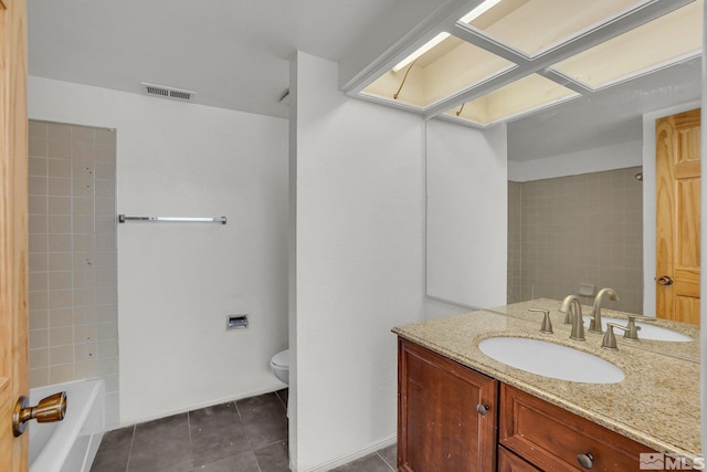 bathroom with toilet, tile patterned floors, visible vents, and vanity