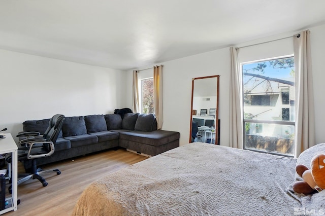 bedroom with light wood finished floors