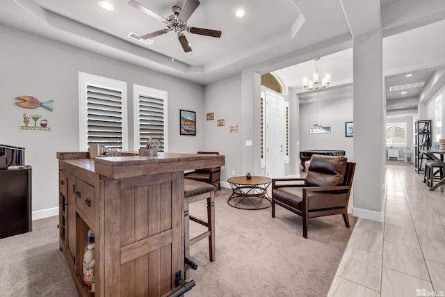 office space featuring recessed lighting, baseboards, light colored carpet, and a raised ceiling