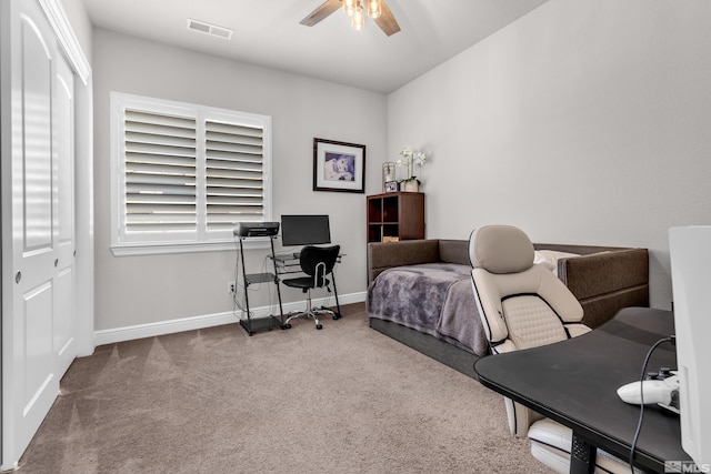 bedroom featuring baseboards, a ceiling fan, carpet flooring, and visible vents
