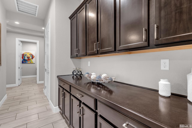bar featuring recessed lighting, baseboards, and visible vents