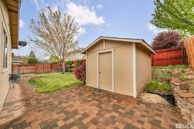 view of shed featuring a fenced backyard