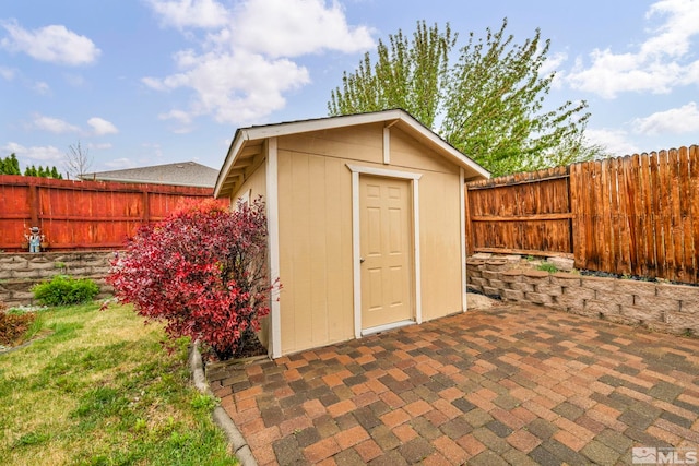 view of shed featuring a fenced backyard