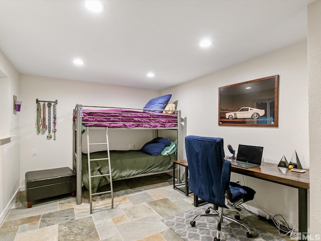 bedroom with baseboards, recessed lighting, and stone tile floors
