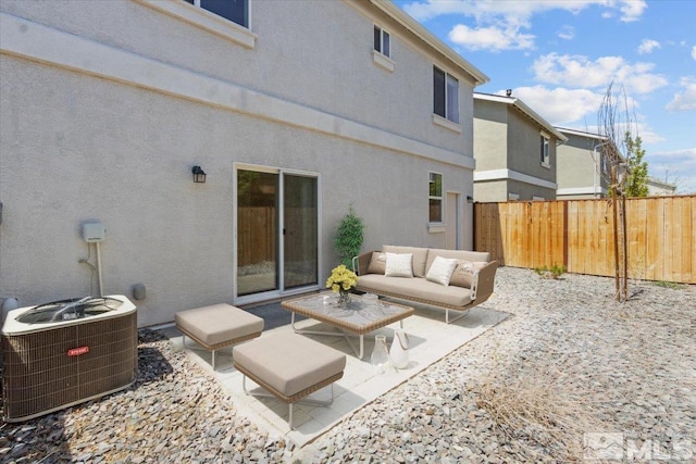 rear view of property featuring central air condition unit, fence, a patio area, and outdoor lounge area