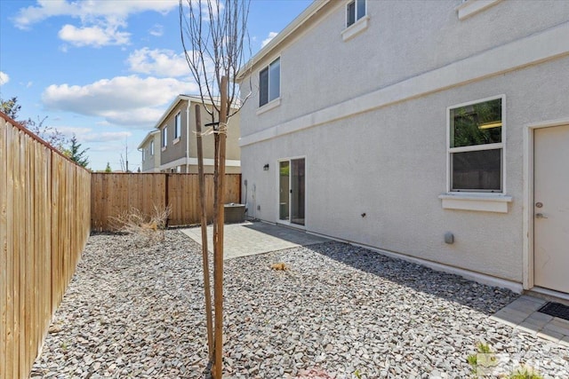 exterior space with a patio and a fenced backyard