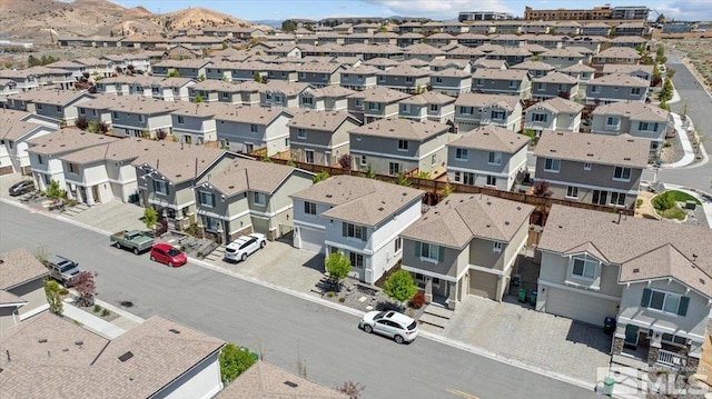 birds eye view of property with a residential view