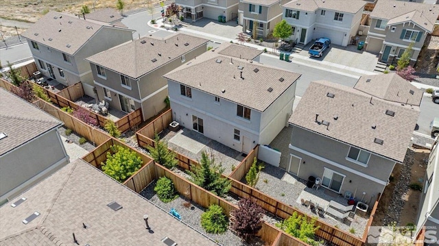 birds eye view of property with a residential view