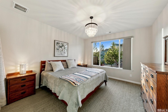 carpeted bedroom featuring baseboards, a chandelier, and visible vents