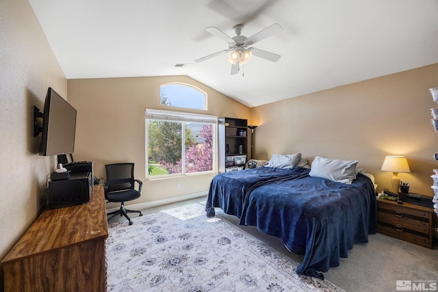 carpeted bedroom with visible vents, a ceiling fan, and lofted ceiling
