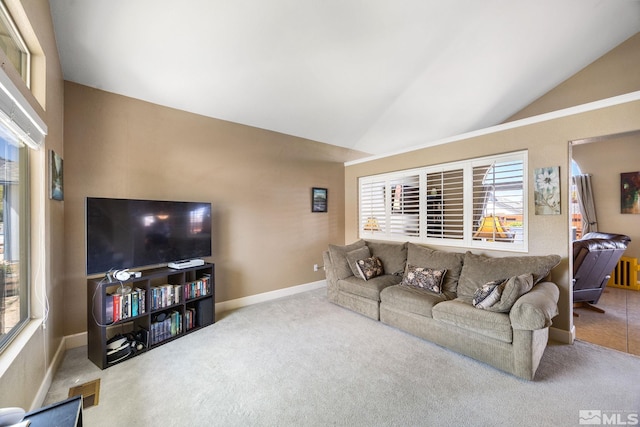carpeted living room with baseboards and vaulted ceiling