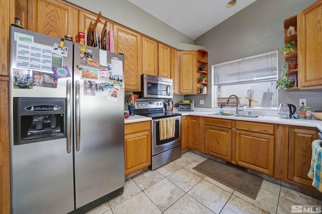 kitchen with a sink, light countertops, open shelves, and stainless steel appliances