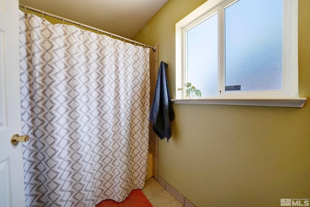 full bath with tile patterned flooring and a shower with shower curtain