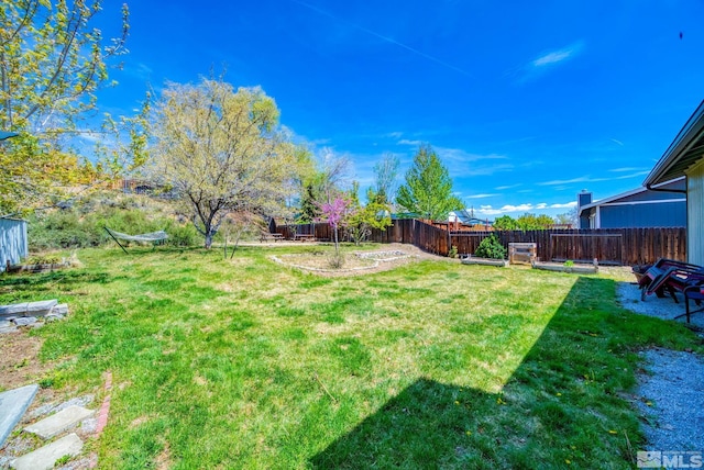 view of yard with a fenced backyard