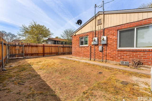 view of yard with a fenced backyard