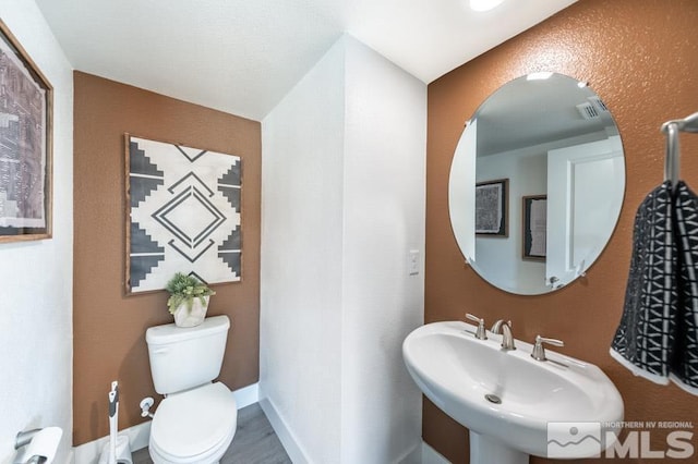 bathroom with a sink and toilet