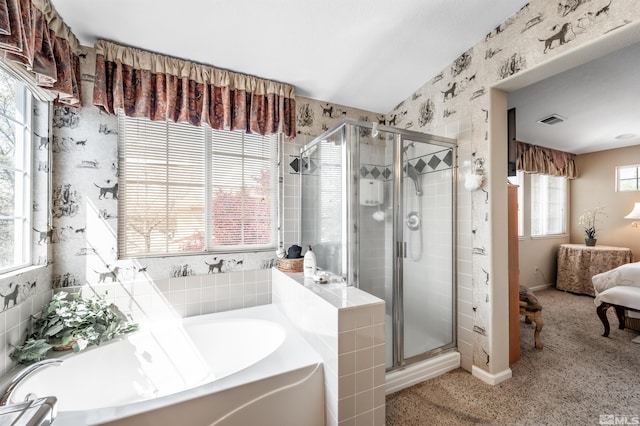 ensuite bathroom with a shower stall, ensuite bath, a garden tub, and visible vents