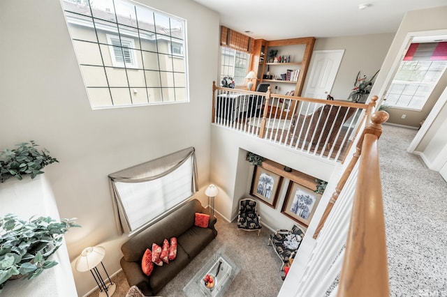 living room featuring carpet floors and baseboards