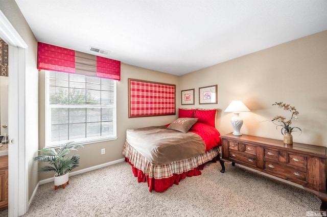 bedroom featuring visible vents, carpet, and baseboards