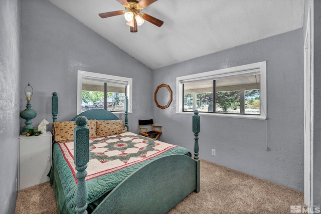 bedroom with carpet, vaulted ceiling, and multiple windows