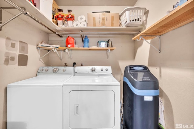 clothes washing area featuring laundry area and washing machine and dryer