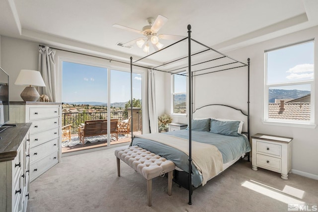 bedroom featuring visible vents, a ceiling fan, light carpet, and access to exterior