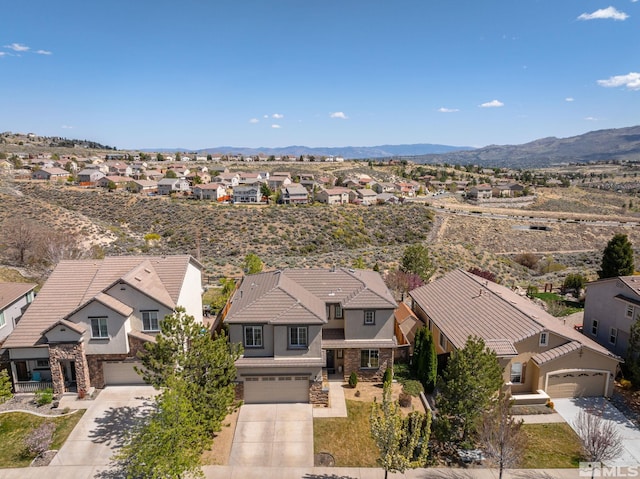 birds eye view of property with a mountain view and a residential view