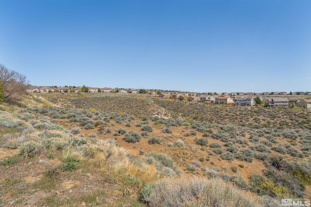 view of landscape featuring a residential view